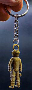 Bomb tech keychain. Metal, gold-tone finish. Detailed figure in protective