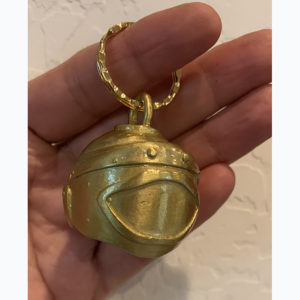 Gold-colored 3D bomb suit helmet motorcycle bell keychain. Detailed