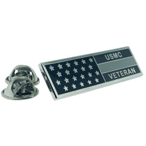 Silver veteran flag pin. Black background with white stars