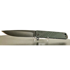 Medford M48 knife on display. Green handle with textured pattern. Gray blade.