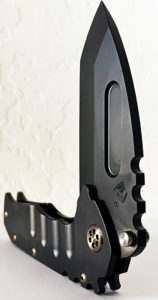 Black Medford Praetorian knife. Features a visible thumb hole and textured