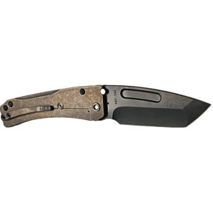 Bronze handled folding knife. Black blade with visible screws. Challenge Coin