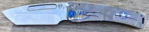 Medford MarauderH Warthog knife. Silver blade with blue handle. Detailed warthog