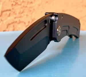 Black Medford Marauder-H knife. Partially open, displaying a Damascus
