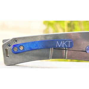 Close-up of a Medford MarauderH Warthog knife. Gray titanium frame, blue handle.