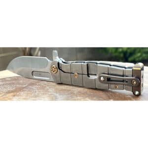 Silver Medford USMC Fighter flipper knife. Visible hardware with gold