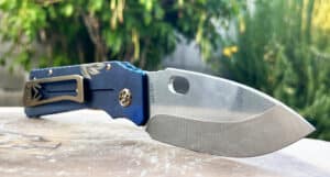 Medford TFF1 tactical folder. Silver blade, blue handle with gold hardware.