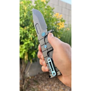 Medford USMC Fighter flipper knife. Gray titanium blade and handle. Blue