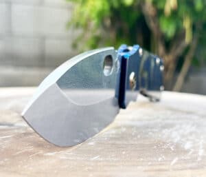 Medford TFF1 tactical folding knife. Gray blade, blue handle. Visible