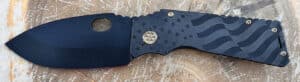 Blue Medford TFF1 Tactical Fighting Folder knife. Features a coin inlay and star pattern on the handle. Steel hardware